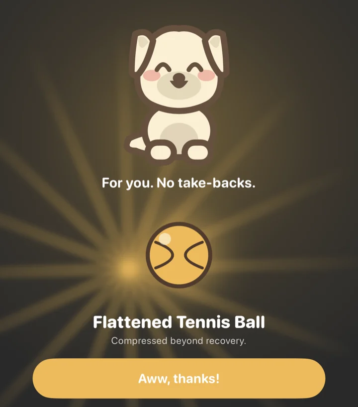 Biscuit brings a doggy bag: a Flattened Tennis Ball, Compressed beyond recovery, with an Aww, thanks! button